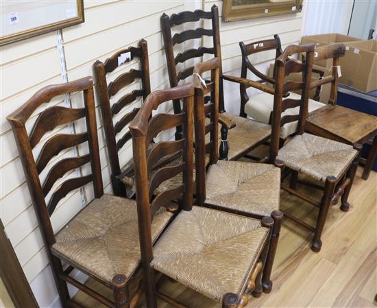 An early 19th Century elm ladderback rush-seat elbow chair, 5 similar dining chairs, a Regency mahogany elbow chair and an elm-seat cha